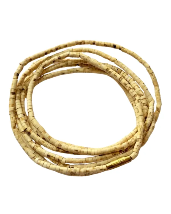 Beaded wooden bracelet strands looped together on a white background.