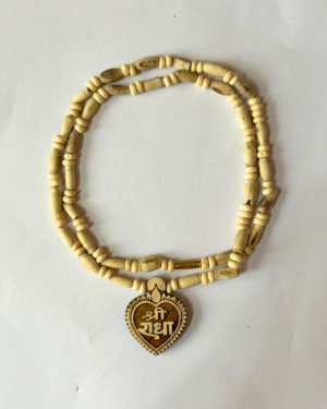Beaded wooden necklace forming a loop, with a heart-shaped pendant featuring carved designs at the bottom center of the image.